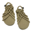 Pair of beige rope sandals on a white background