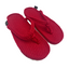 Pair of red slippers on a white background