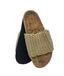 Pair of slippers with knitted top and cork sole on a white background